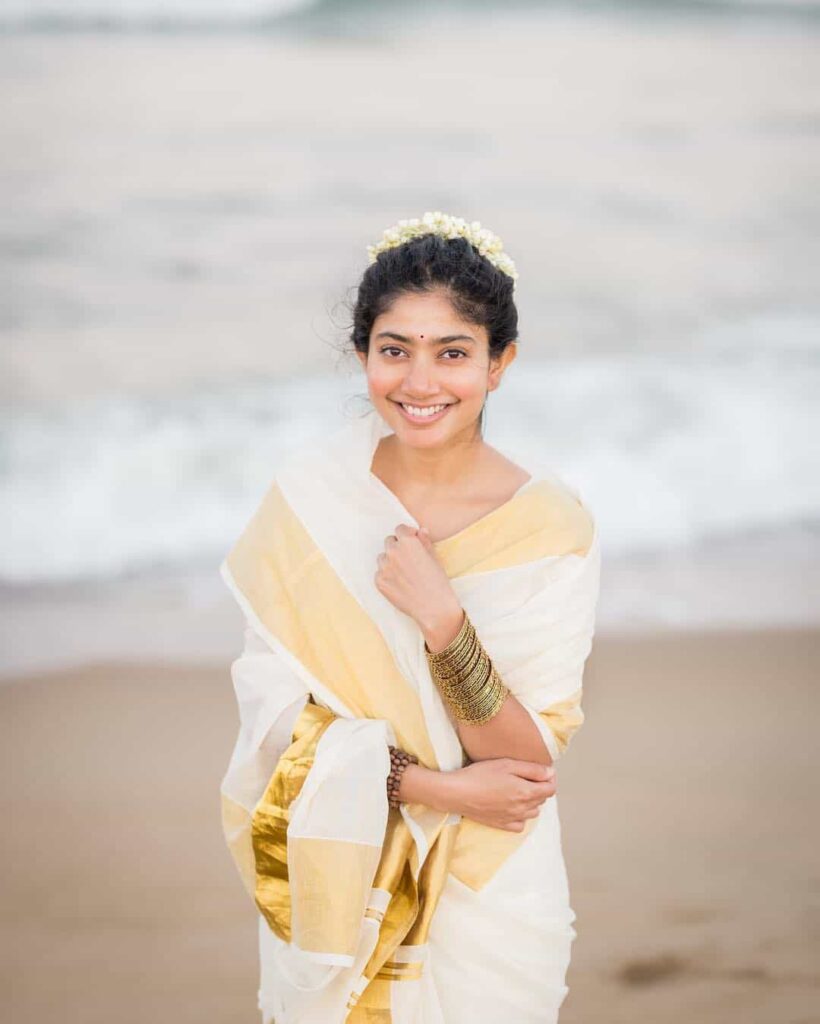 Sai Pallavi Wear South Indian Traditional White with Gold Patti Saree Looks very stylish and gorgeous